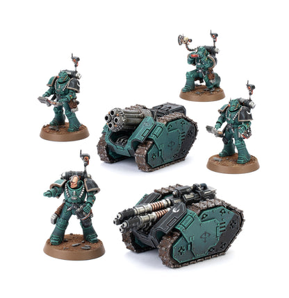 Two Legiones Astartes Rapier Laser Destroyer vehicles and four space marine figures in dark green armor are displayed