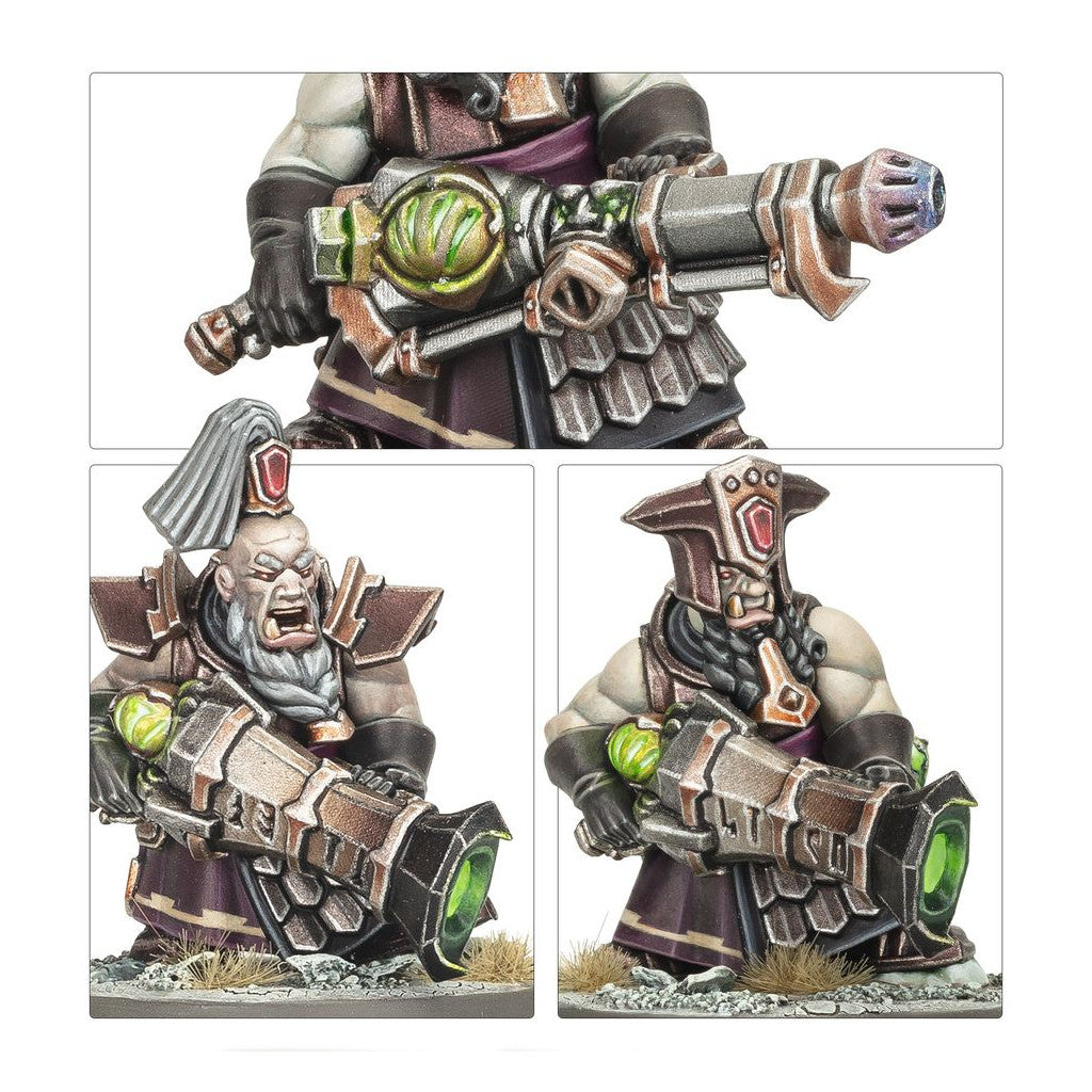 Showcase of two painted Chaos Dwarf Infernal Razers miniatures wielding huge, ornate blunderbuss weapons with glowing green components