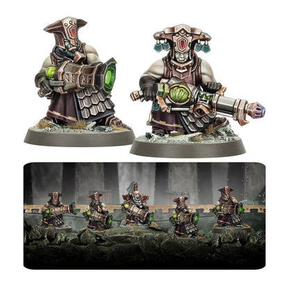 Fully painted Chaos Dwarf Infernal Razers miniatures, depicted with ornate helmets, dark armor, and large infernal weapons that emit a vibrant green light