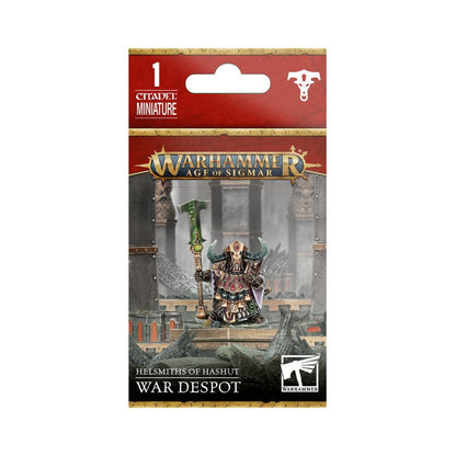The packaged Warhammer Age of Sigmar miniature displays the Helsmiths of Hashut War Despot, an armored figure with a horned helmet and a large green battle-axe