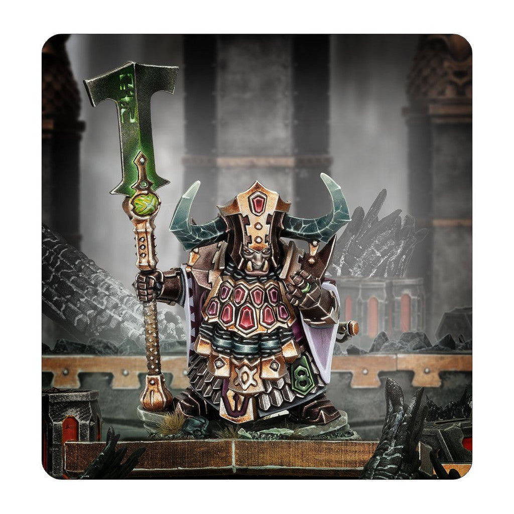 This miniature features the Chaos Dwarf War Despot in segmented armor and a horned helmet, gripping a towering, mystical green halberd in a grim dungeon setting