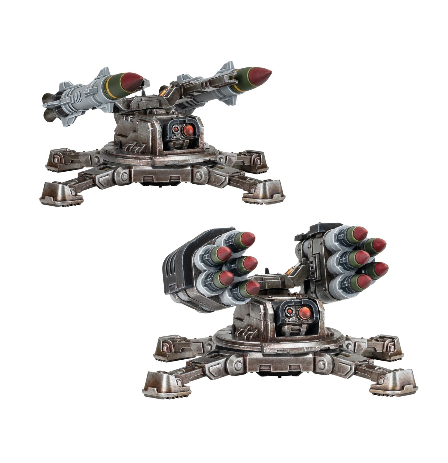 Two Legiones Astartes Tarantula Missile Battery models on white, one with two large missiles, the other with two clusters of three smaller missiles, both on four-legged bases