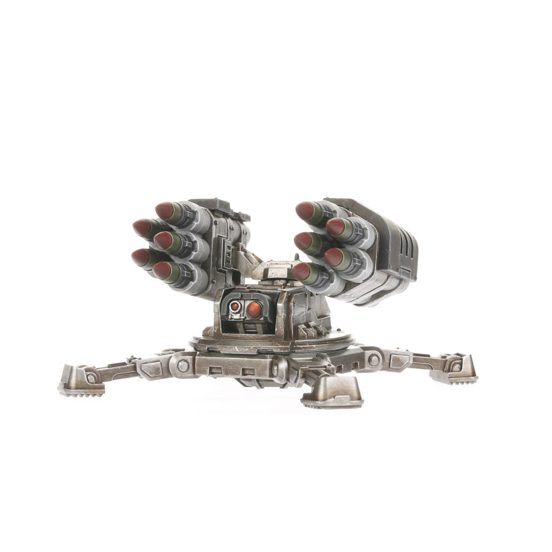 A Legiones Astartes Tarantula Missile Battery, a grey robotic turret with twin missile pods, resting on a tripod base with red sensor lights