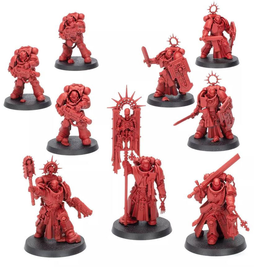The Warhammer 40k Dawn of War Onslaught set featuring ten red plastic miniatures including a banner bearer, sword users, and troops with bolters