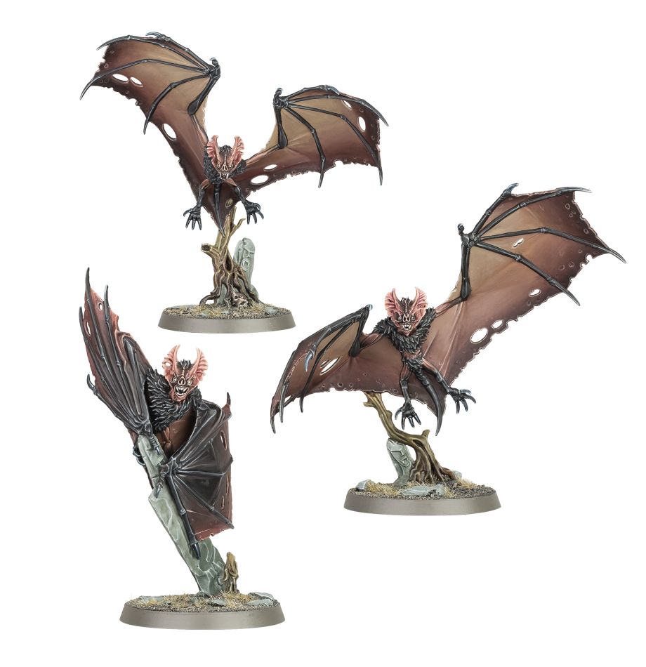Three monstrous undead bat creatures with tattered wings and grim faces stand posed on rocky bases and broken gravestones