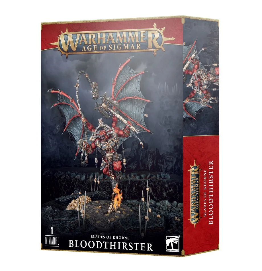 Product box for Blades of Khorne Bloodthirster showing a winged red demon miniature with weapons standing on a pile of skulls with fire against a dark landscape