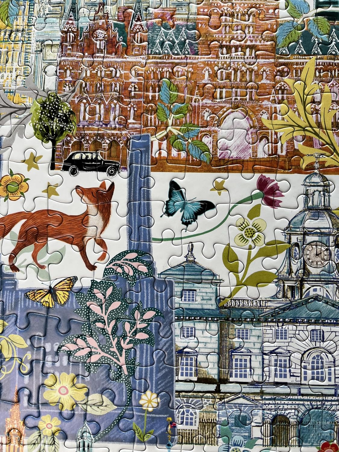 Jigsaw puzzle detail featuring a collage of architecture, a fox, butterflies, and floral patterns.