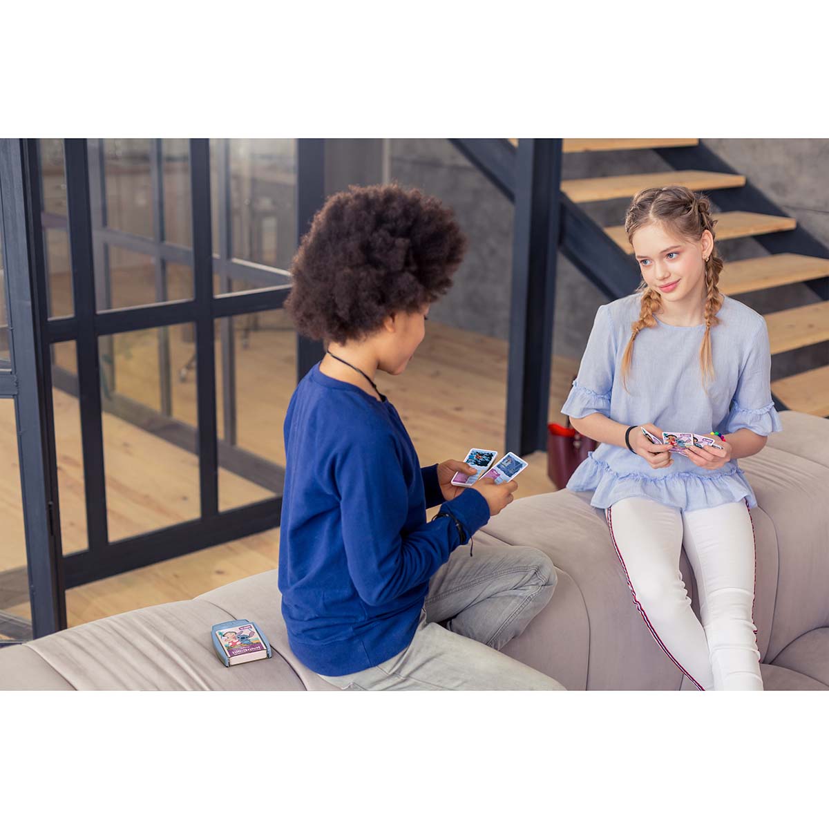 Kids playing Top Trumps Lilo &amp; Stitch card game