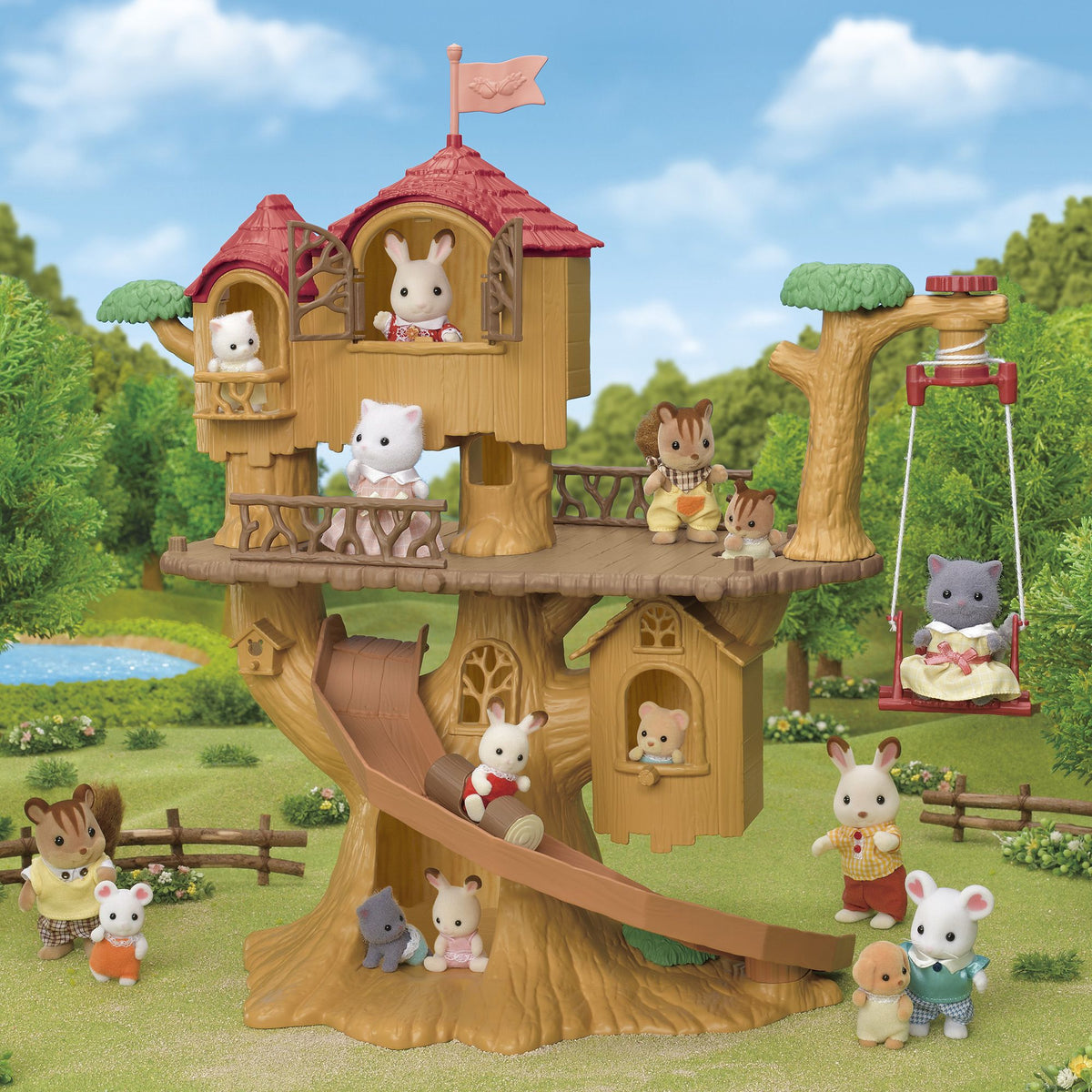 Flocked animal figures play on a large treehouse playset featuring a slide, swing, and lookout posts