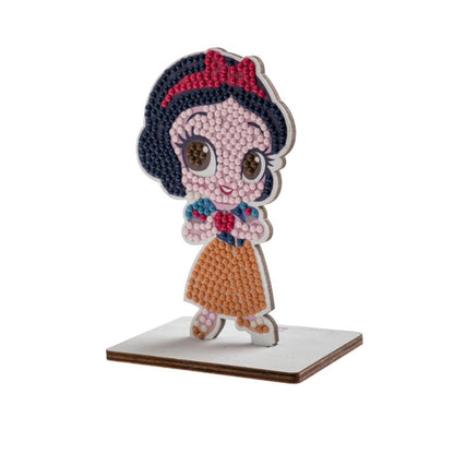 Detailed image of the completed Snow White CrystalArt Buddies figure, showcasing the character made of tiny colored beads standing on a small rectangular base