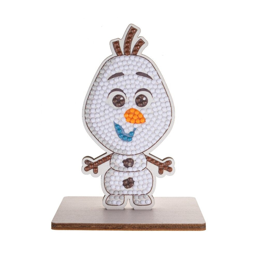 This CrystalArt Buddies kit completed model shows Olaf the snowman standing on a wooden base, decorated with white, orange, and blue diamond dot crystals