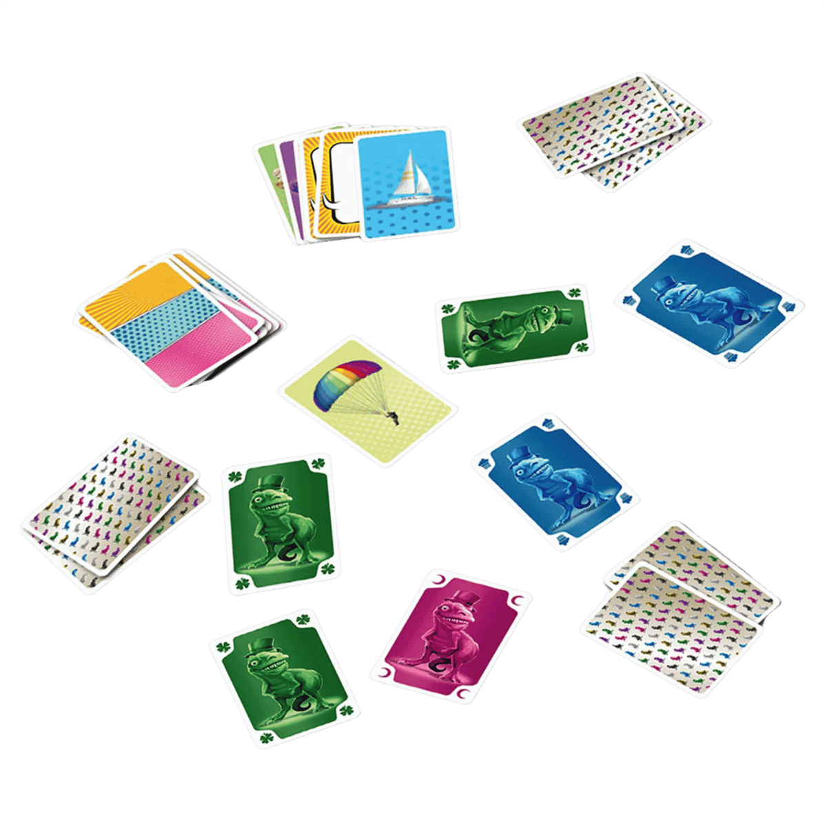 One of Us playing cards are scattered on a green background, showing various colorful designs, a sailboat, a parachute, and dinosaurs in top hats