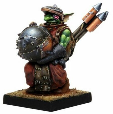 Kings of War Vanguard Goblin Banggit, green skin, red robes, metal armor, carrying a large bomb, with back rockets