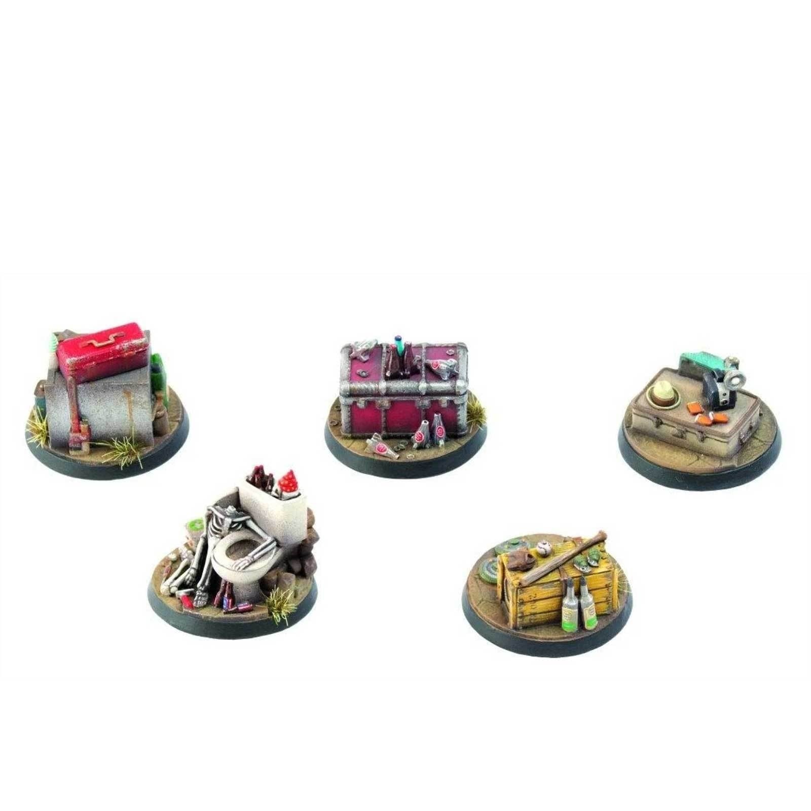 Five Fallout Wasteland Warfare objective markers, including a red toolbox, a purple chest, a sewing machine on a suitcase, a toilet with a skeleton, and a wooden crate with bottles