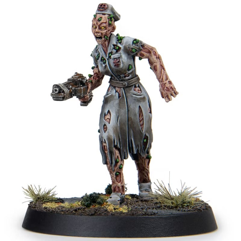 Decaying zombie nurse miniature wearing a tattered uniform and cap, covered in green growths, holding a futuristic pistol