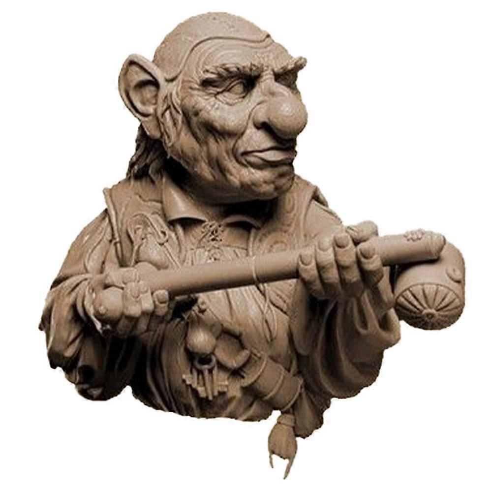 A brown sculpted model of Hoggle, featuring a wrinkled face, large nose, and ears, holding a detailed staff