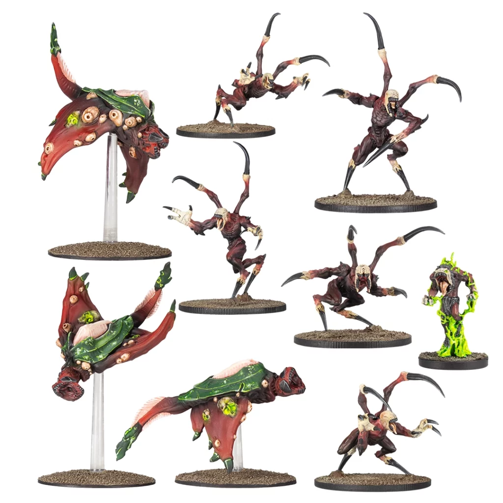 Nine grotesque monster miniatures from the Deadzone Nightmare Incursion Booster, including multi-limbed, winged, and an ooze-covered creature