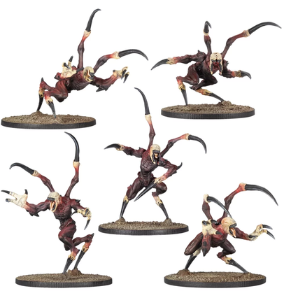 Five painted miniature figures from the Deadzone Nightmare Incursion Booster, each a reddish-brown multi-limbed creature with claws and a pale skull-like head, on a round base