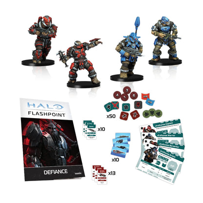 Four painted Halo Jiralhanae miniatures in red and blue armor are displayed alongside the Defiance booklet, unit cards, and dozens of game tokens