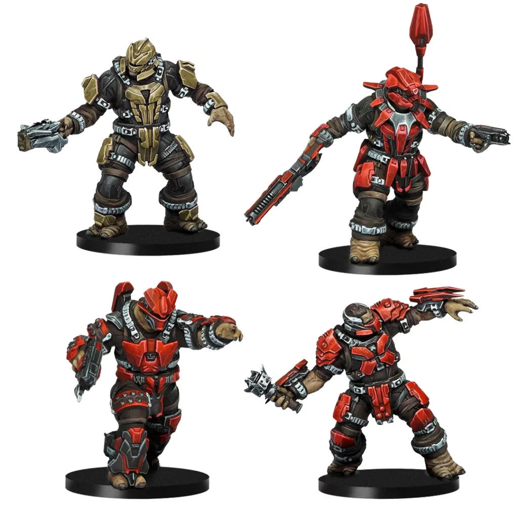 Four highly detailed Halo Brute figures stand on black bases, including one tan armored figure and three prominently red armored Jiralhanae variants
