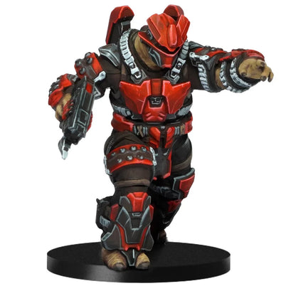 A detailed HALO Flashpoint Jiralhanae miniature clad in aggressive red and black armor, depicted in a running stance while holding a plasma pistol on a black stand