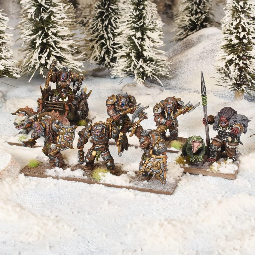 A group of armored miniature ogre warriors with various weapons, one on a beast-drawn cart, in a snowy forest