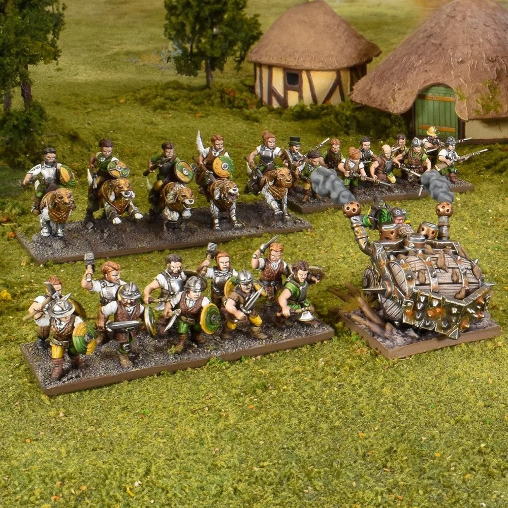 Fantasy wargame miniatures on a green field: foot soldiers, boar-riding cavalry, and a large, steam-powered war machine firing