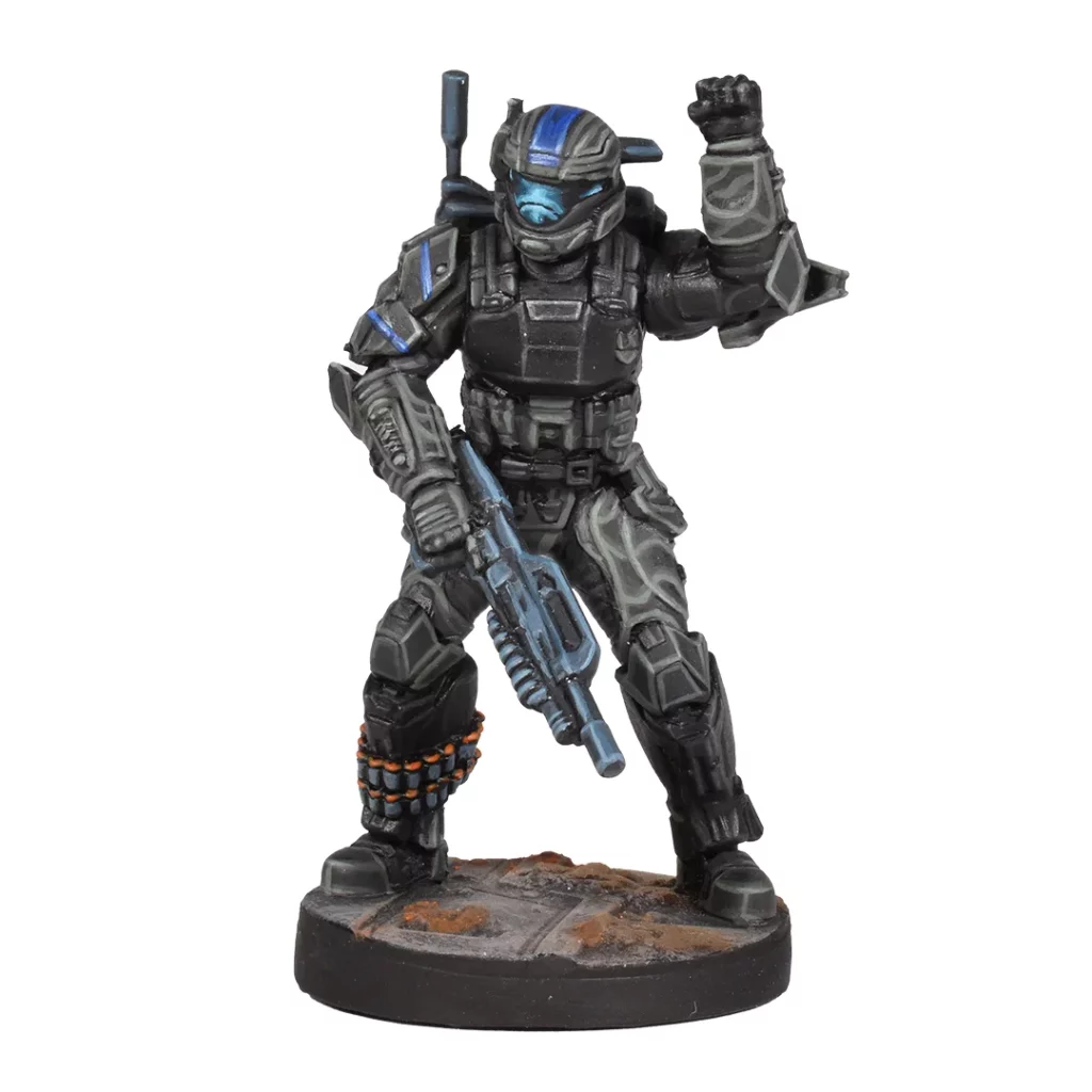 Detailed Halo ODST miniature figure in black armor with a blue visor holding a weapon and raising one fist