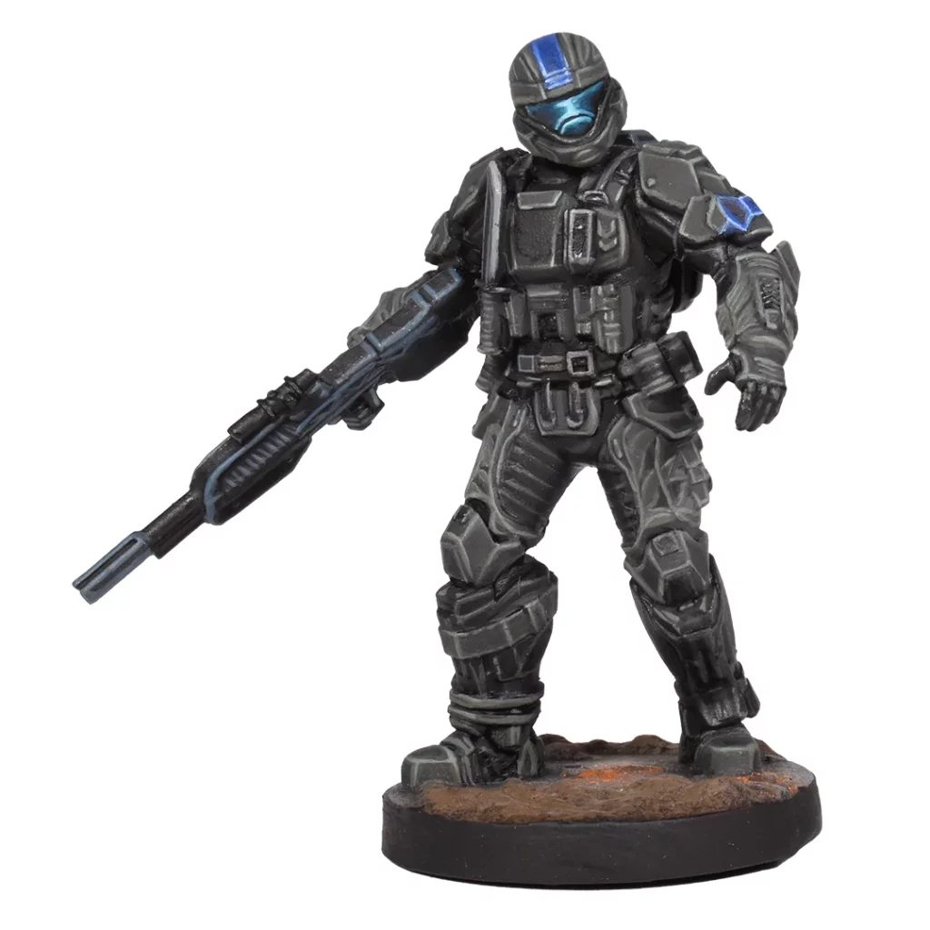 A gray Halo ODST miniature figure with a bright blue visor holds a rifle and stands on a brown and black gaming base
