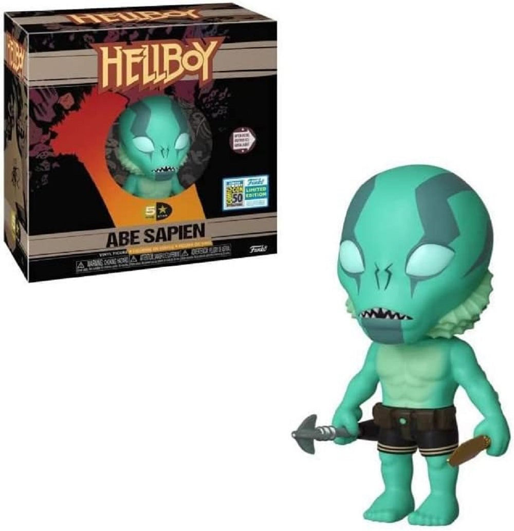 Teal Abe Sapien collectible figure (Hellboy) holding a harpoon gun, standing next to its box
