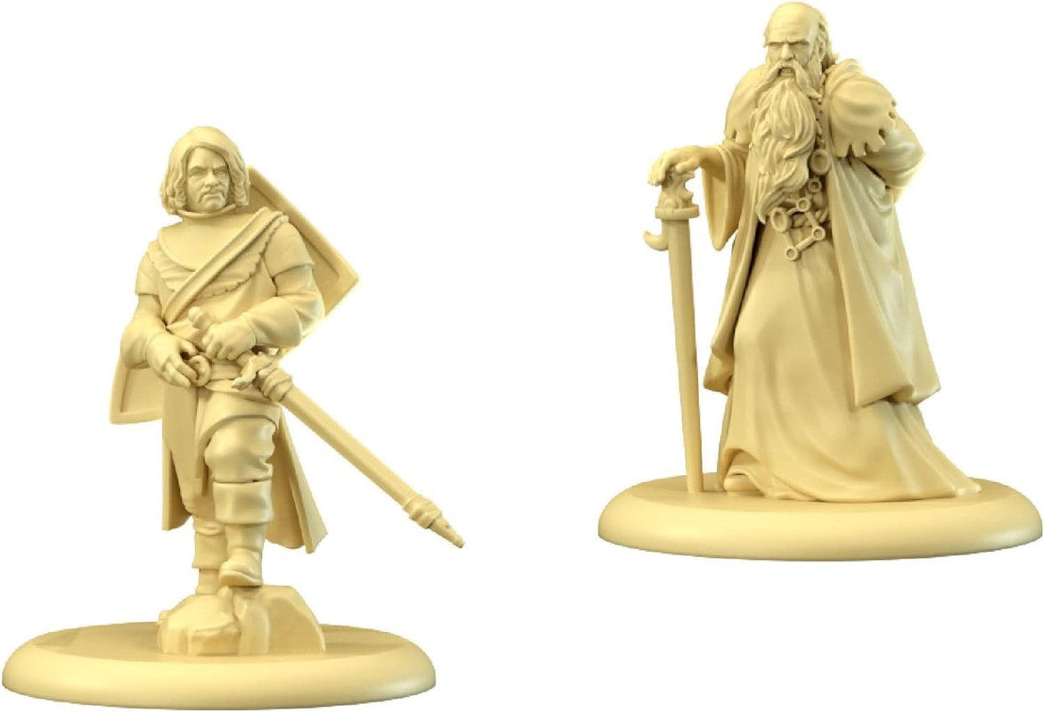 Two unpainted, cream-colored fantasy miniatures: a warrior with a sword and shield, and a bearded wizard holding a staff