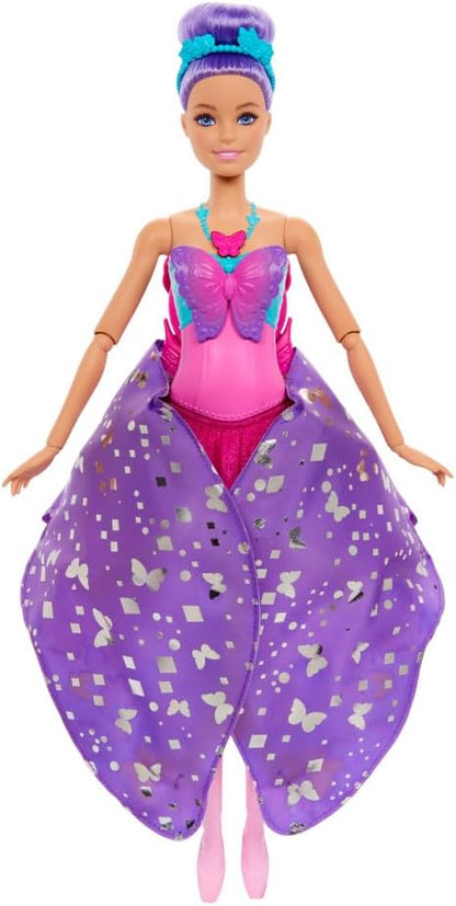 A Barbie doll with purple hair in a bun -  wearing a pink butterfly top -  a purple skirt with silver butterfly patterns -  and pink ballet shoes