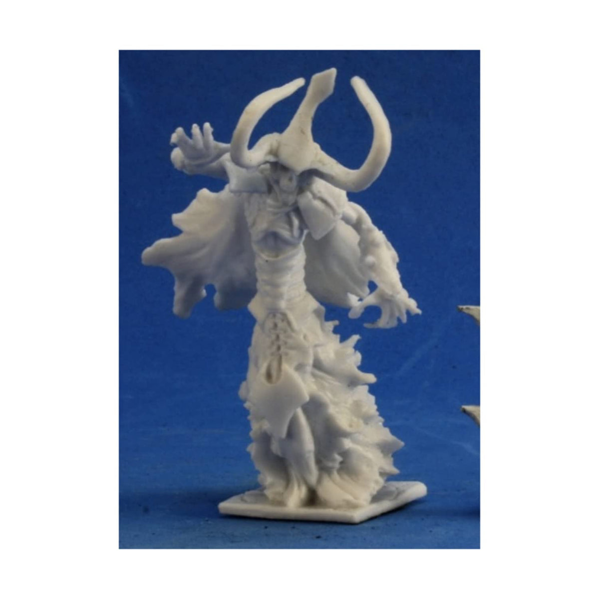 White miniature of a horned demon or warlock in robes with hands raised, on a base