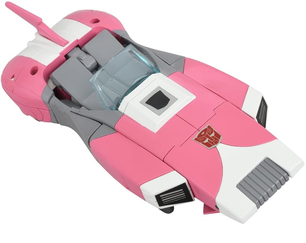 Pink, gray, and white futuristic vehicle toy with an Autobot symbol