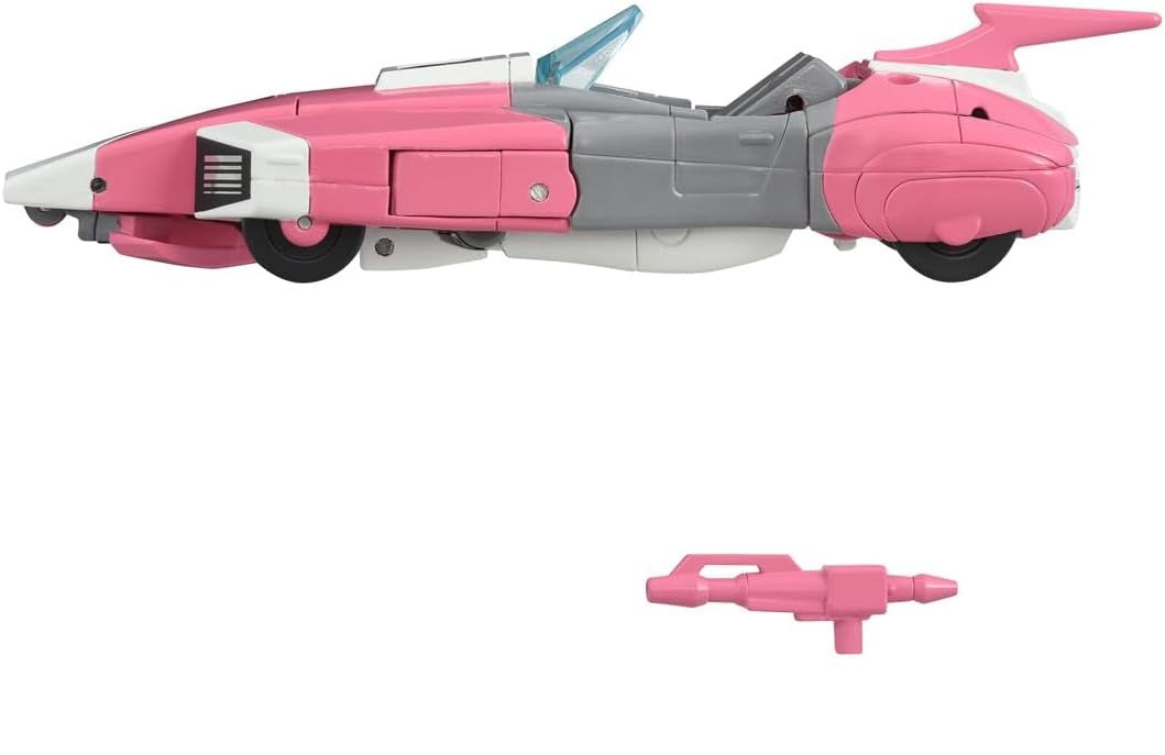 Pink and gray futuristic convertible toy car mode (like Arcee) with a small pink blaster accessory below it