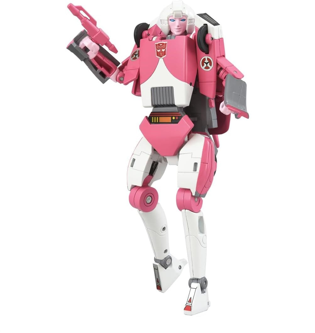 Pink and white Transformers Arcee action figure holding a blaster gun, posed dynamically mid-air