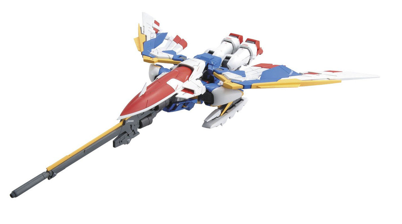 Red, white and blue transforming Mobile Suit model in jet mode, featuring wide wings and a long frontal cannon