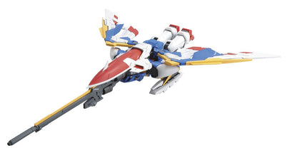 Red, white and blue transforming Mobile Suit model in jet mode, featuring wide wings and a long frontal cannon