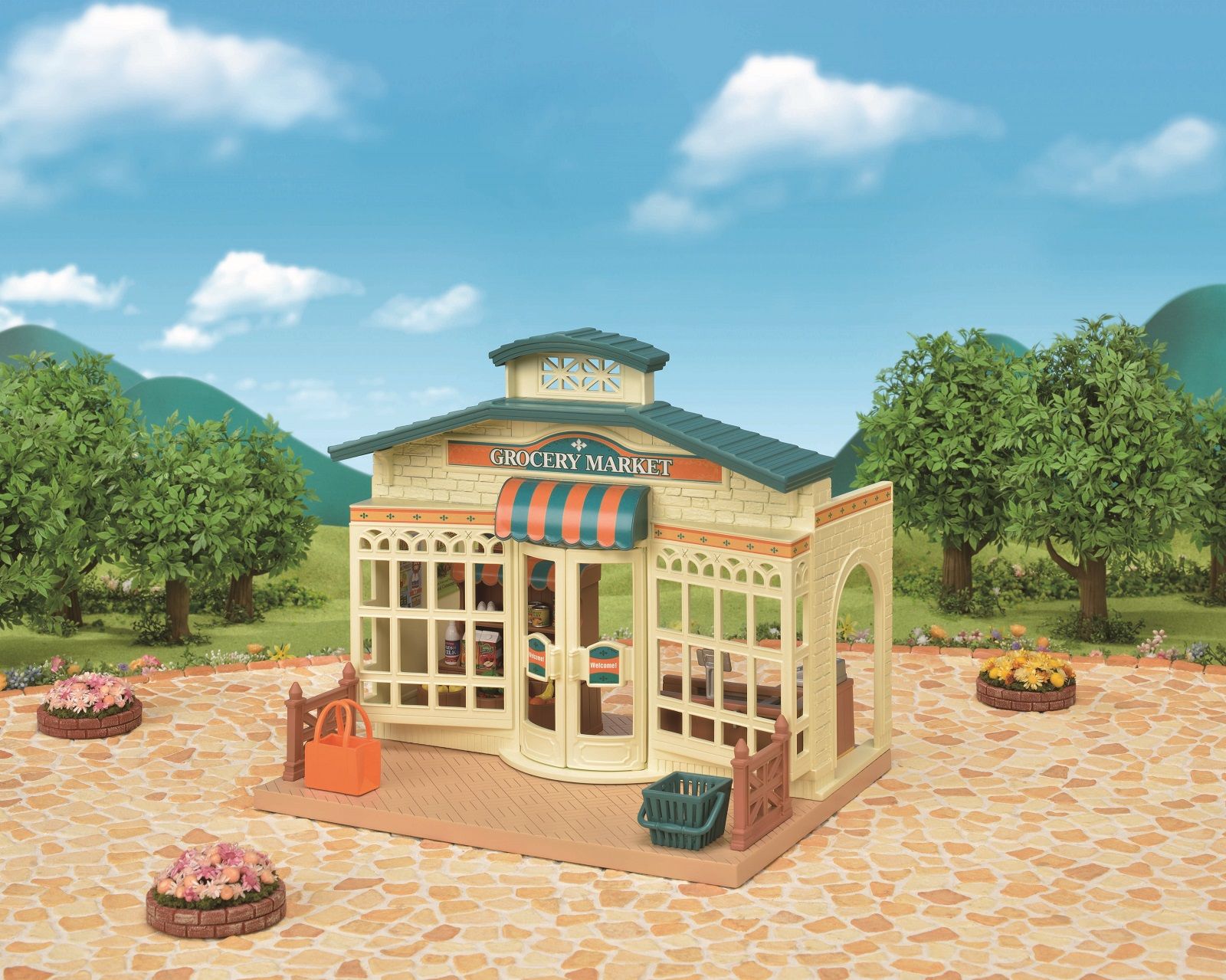Detailed toy grocery market building with a striped awning, set outdoors on a stone patio