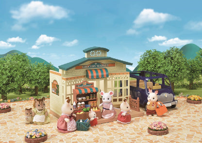 Sylvanian Families animal figures shopping outside a miniature Grocery Market playset with a van
