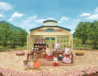A miniature outdoor toy scene of flocked animals buying groceries at a market stall