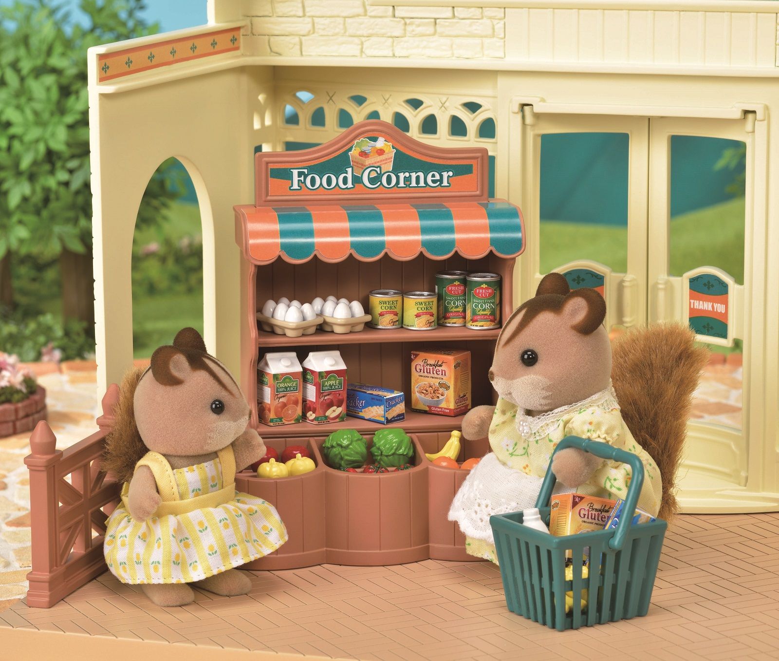 Two toy squirrel figurines shopping at a miniature "Food Corner" grocery stall
