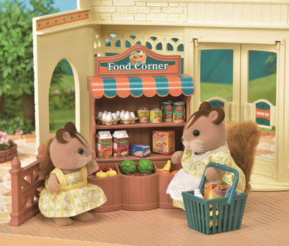 Two toy squirrel figurines shopping at a miniature "Food Corner" grocery stall