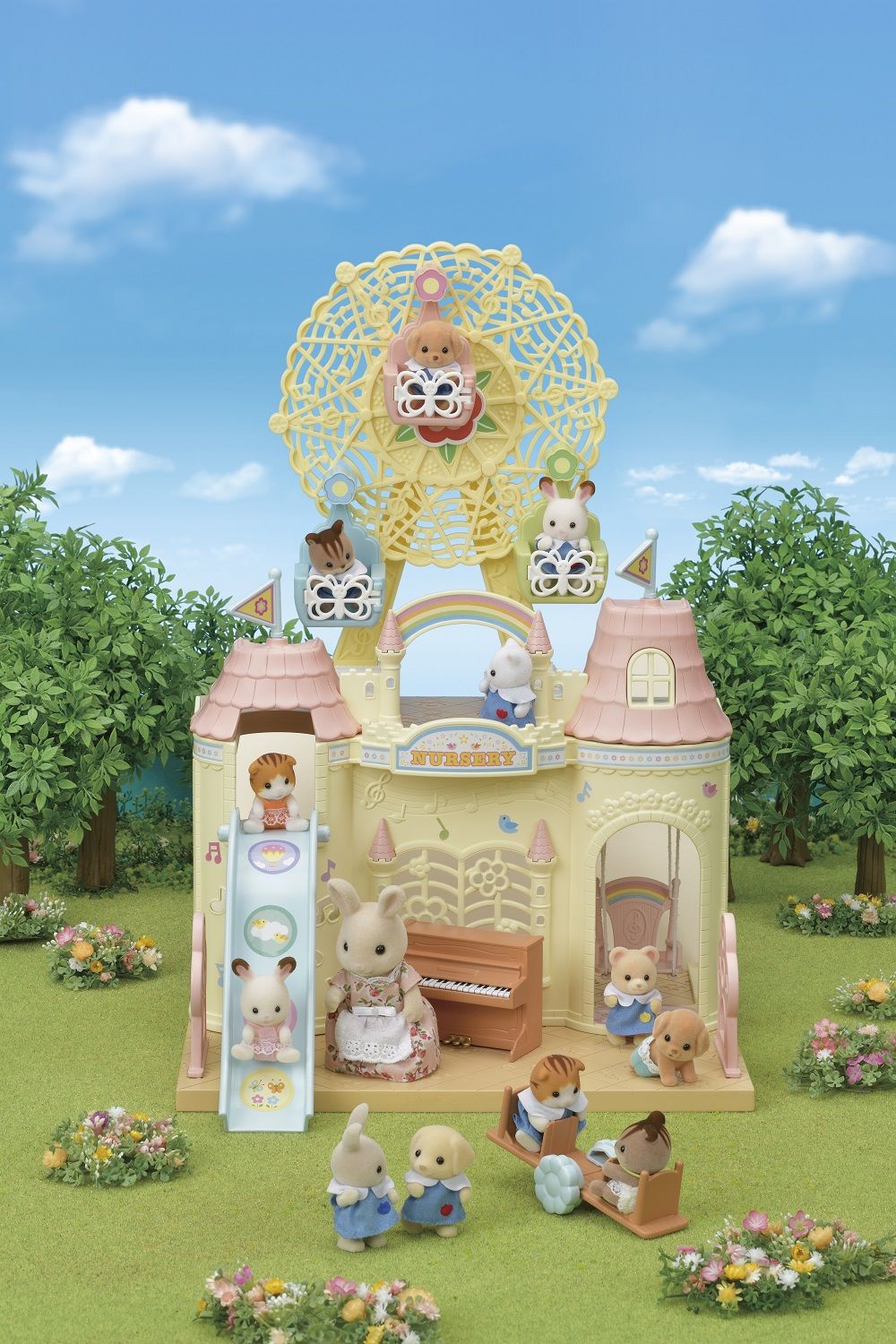 Sylvanian Families castle nursery play set featuring a Ferris wheel, slide, and several baby animal figures playing outdoors