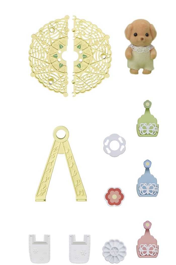 Flocked tan puppy toy figure surrounded by numerous miniature plastic accessories and decorative pieces