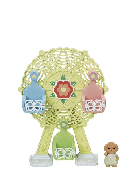 Toy Ferris wheel with three coloured seats and a small puppy figure