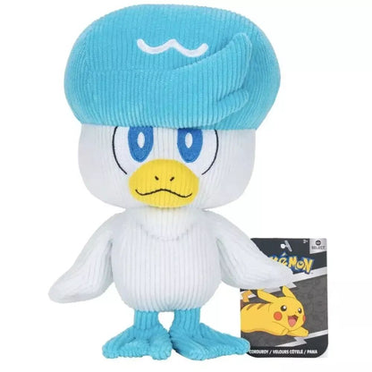 White and blue corduroy Quaxly Pokemon plush toy, a white duck with a blue cap, standing with its retail tag