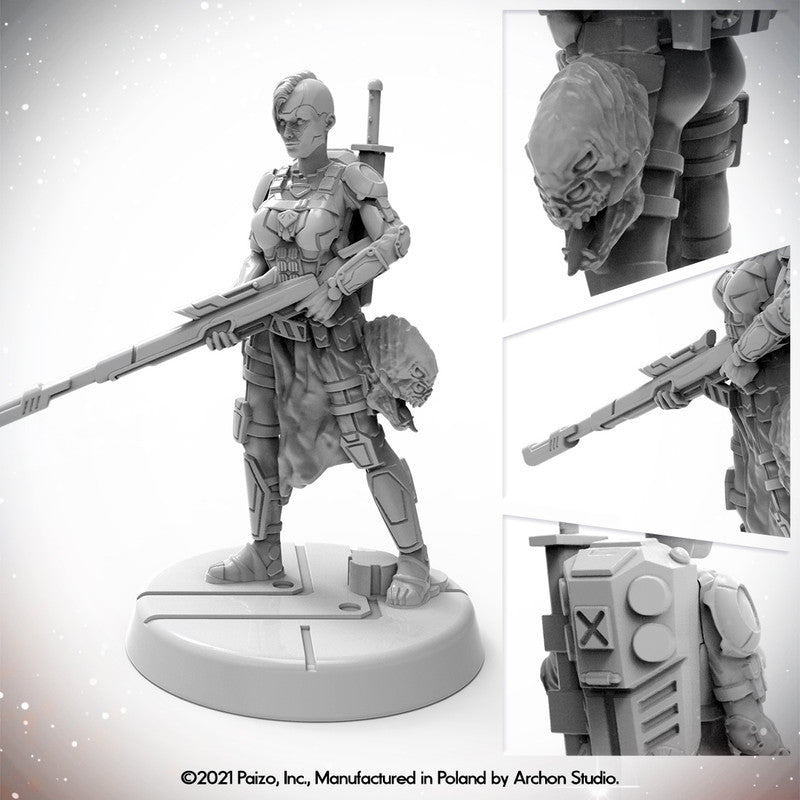 Unpainted Starfinder Android Xenoseeker miniature of a female warrior in armor holding a rifle, with a sword and an alien head trophy