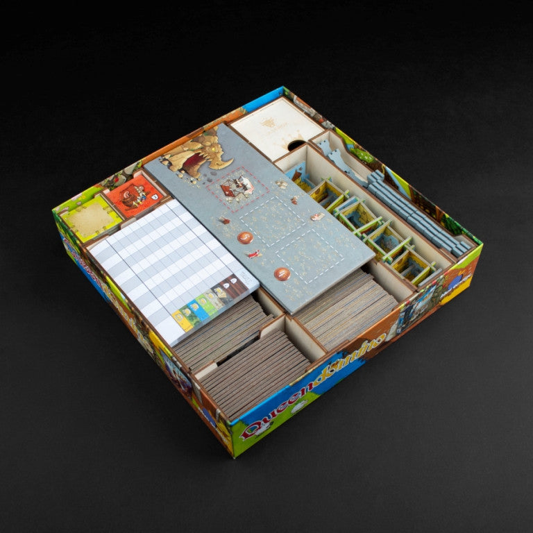 Wooden game insert holding Kingdomino tiles and components