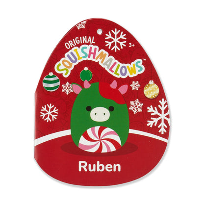 Squishmallows hangtag for Ruben, a green Christmas cow with a peppermint belly, on a red background with snowflakes